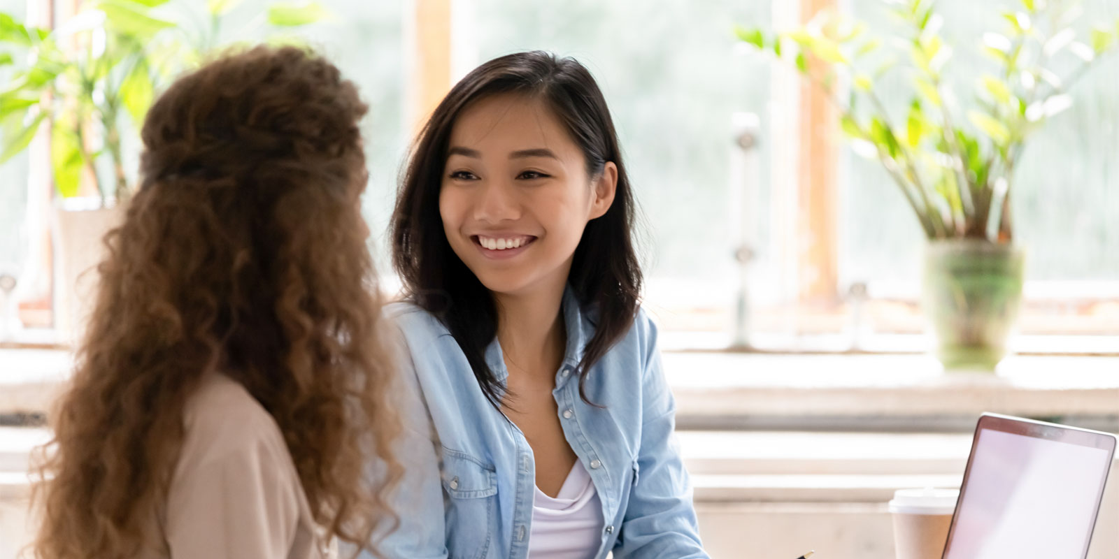 a business insurance agent speaking with a small business owner